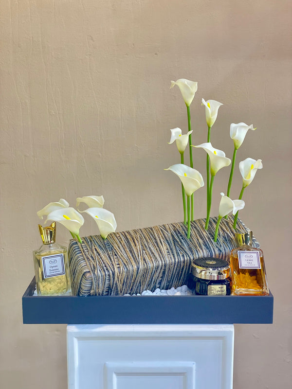 Calla lily and perfumes arrangement