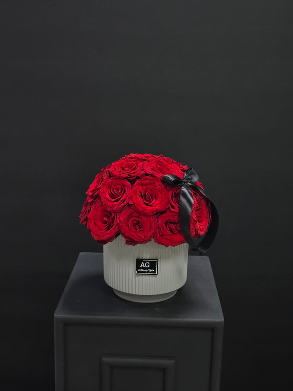 Timeless Romance: Red Roses in Ceramic Vase